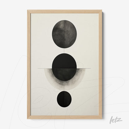 framed geometric wall art in black and white featuring circles on a light background with a light wood frame
