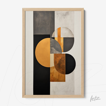 framed geometric wall art in black, white, and gold tones with light wood frame