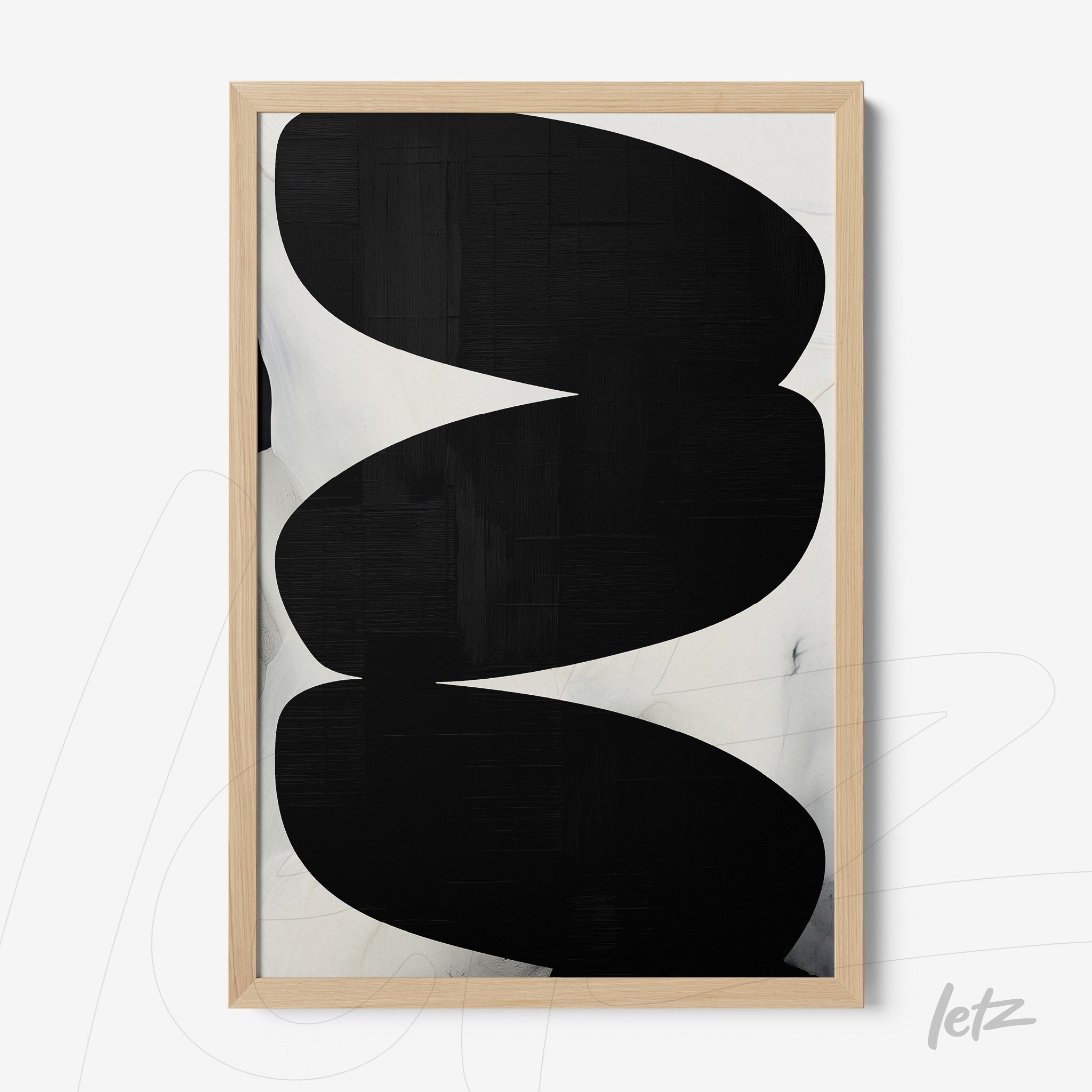 abstract wall art featuring curved black shapes on a light background with a light wood frame