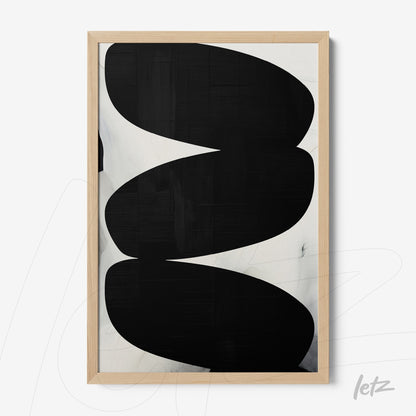 abstract wall art featuring curved black shapes on a light background with a light wood frame