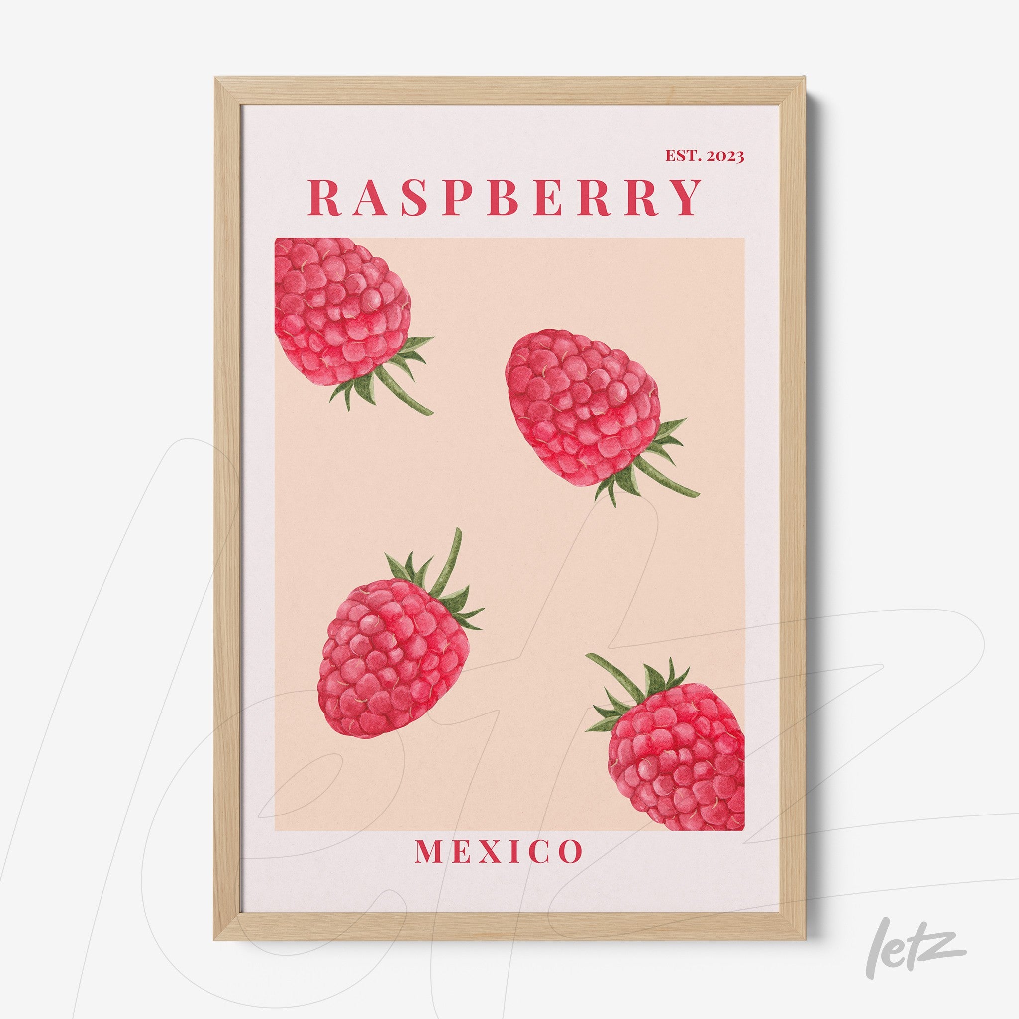 framed wall art featuring illustrative raspberries on pink background with light wood frame