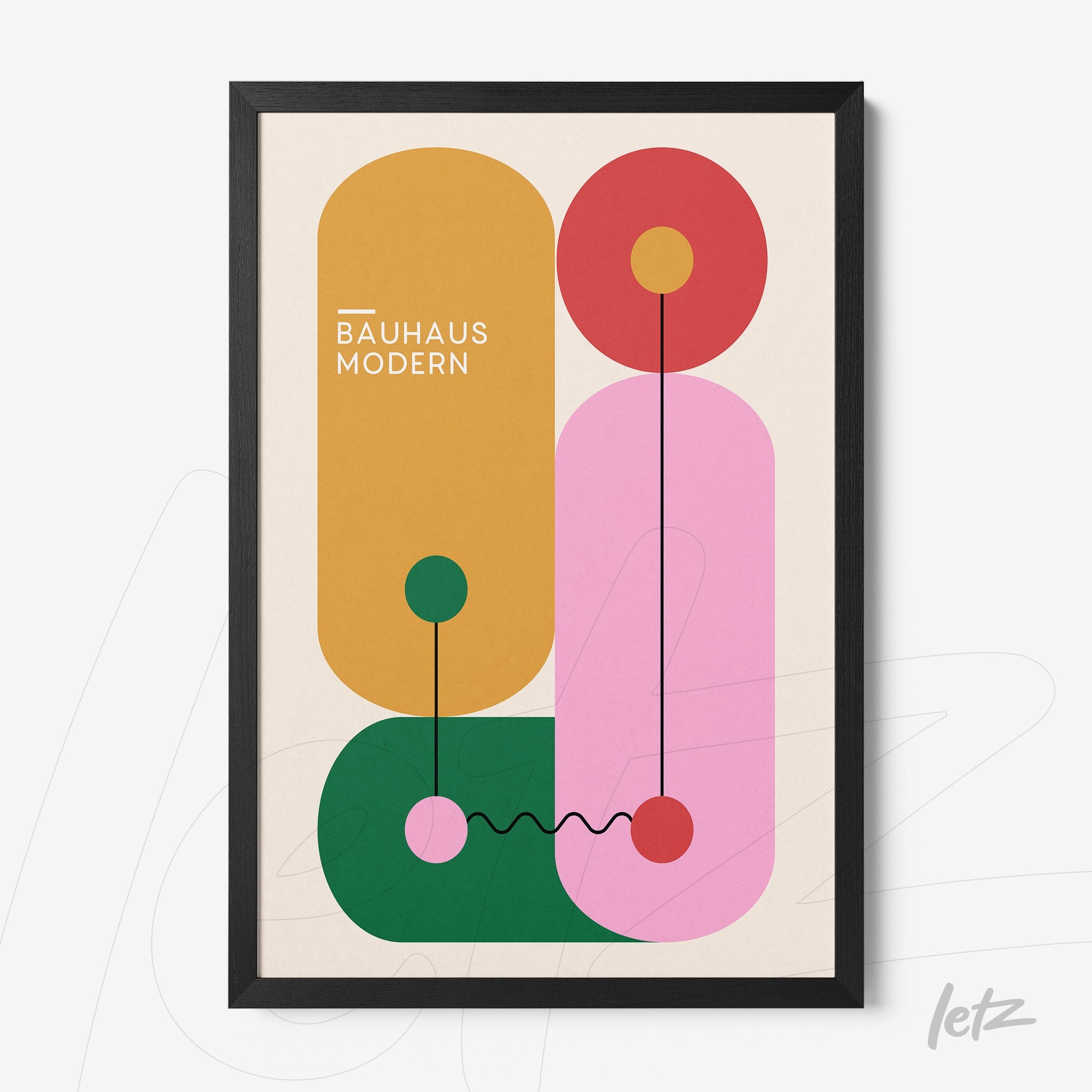 framed wall art featuring modernist bauhaus geometric design with oval and circular shapes in brown, red, pink, and green, with a thin black frame