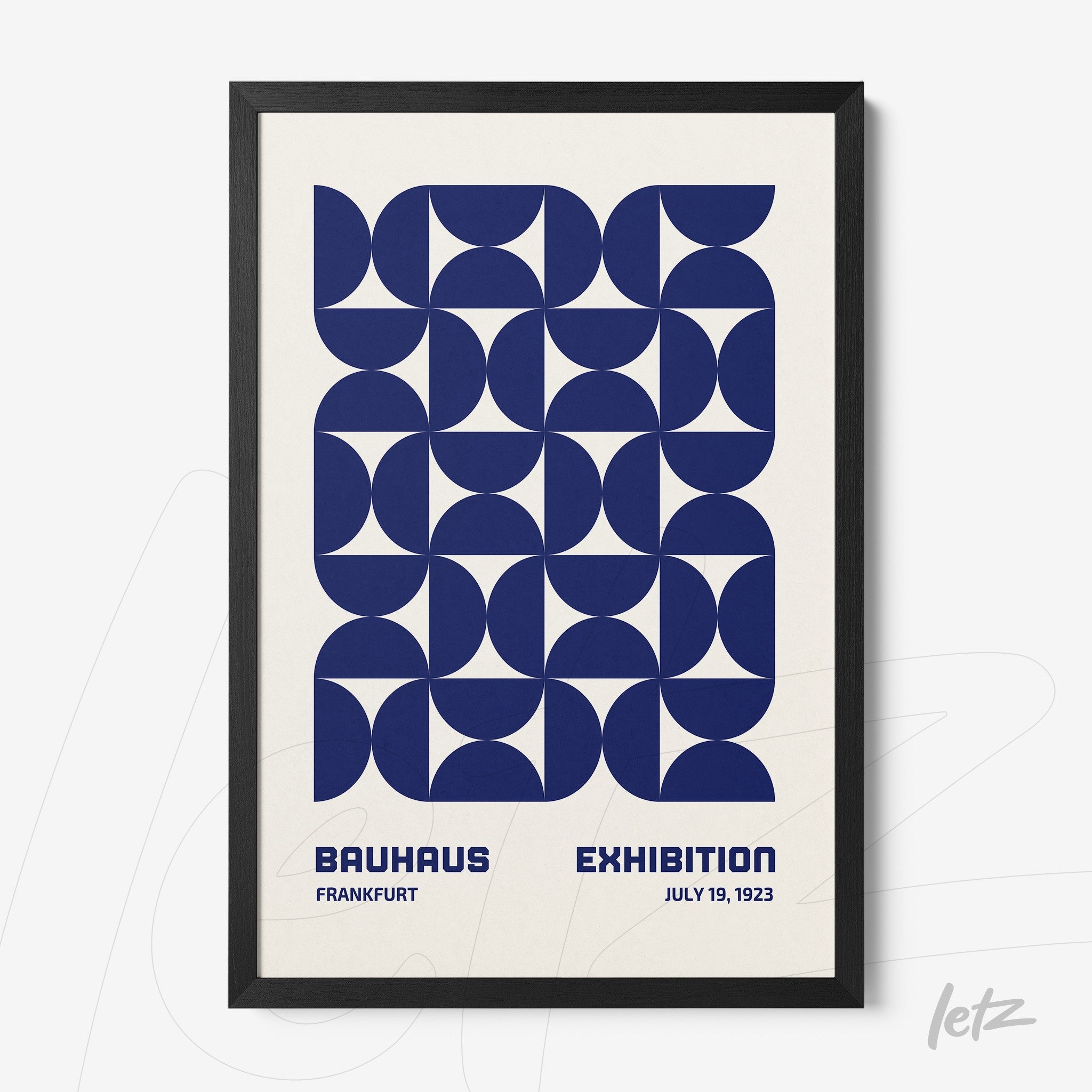 poster featuring blue geometric patterns and text referring to the 1923 Bauhaus exhibition in black frame