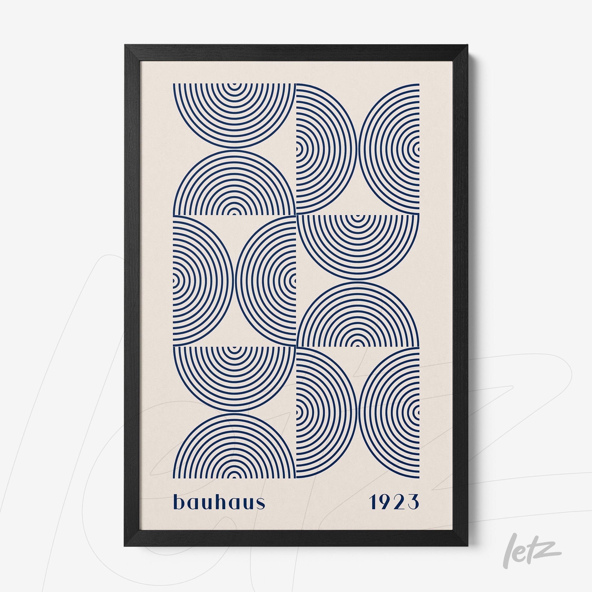print of concentric circles in blue with the inscription bauhaus 1923 in a black frame