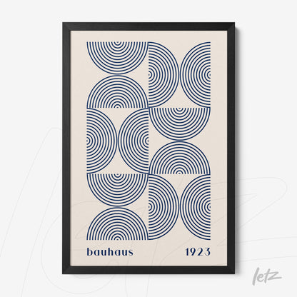 print of concentric circles in blue with the inscription bauhaus 1923 in a black frame