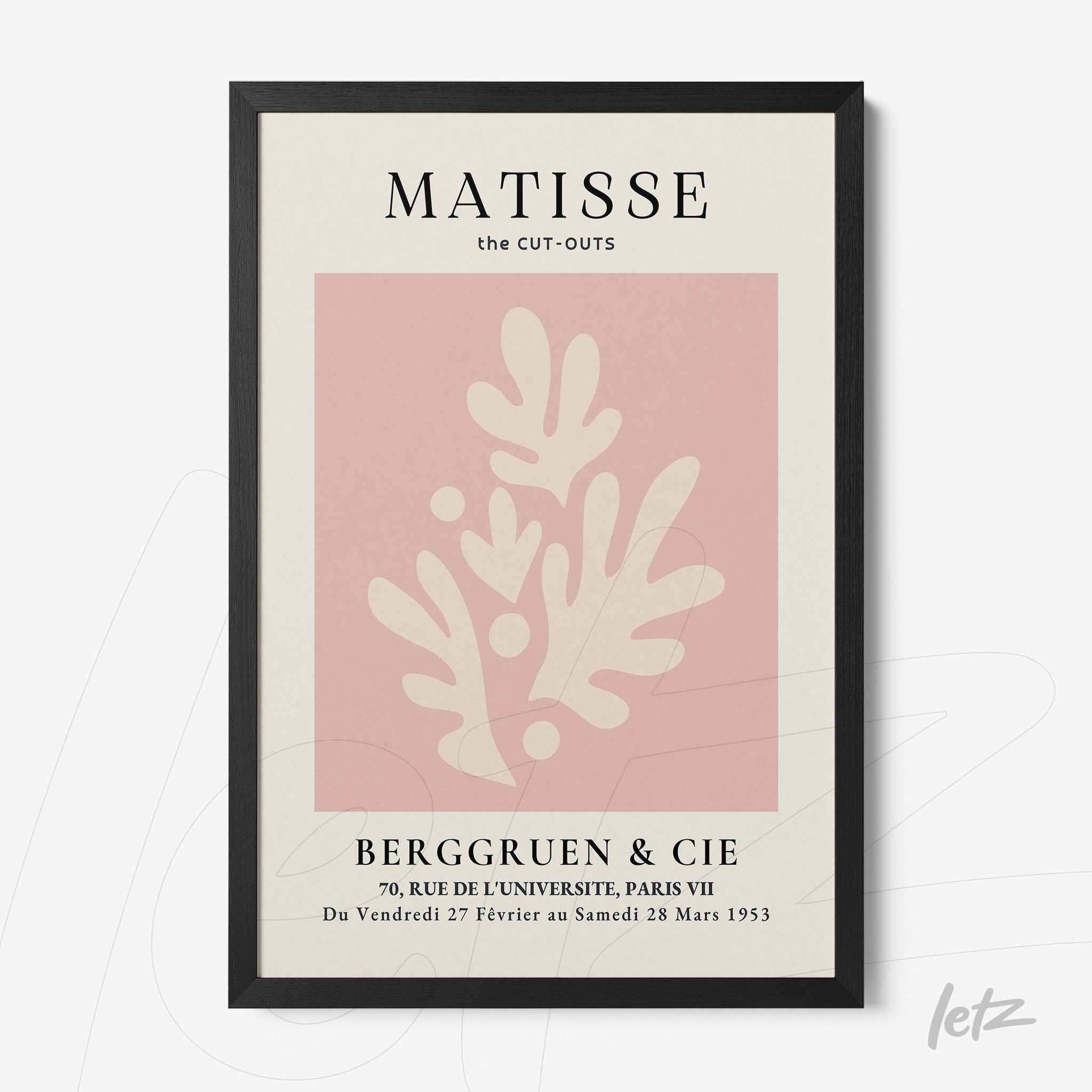 framed wall art featuring abstract pink shapes on a cream background with a thin black frame