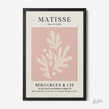 framed wall art featuring abstract pink shapes on a cream background with a thin black frame