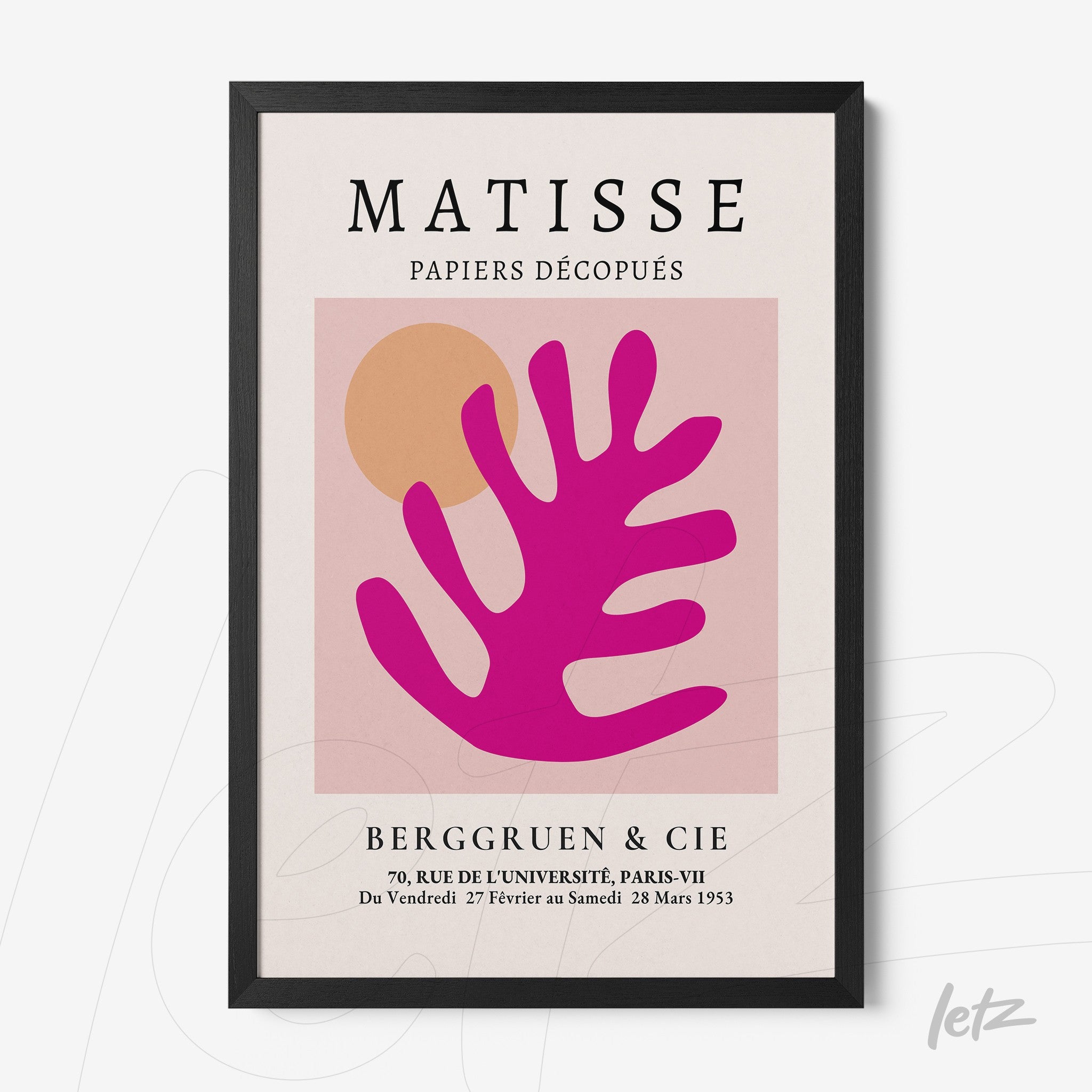 framed modern abstract art featuring a pink leaf shape on a light background with black frame