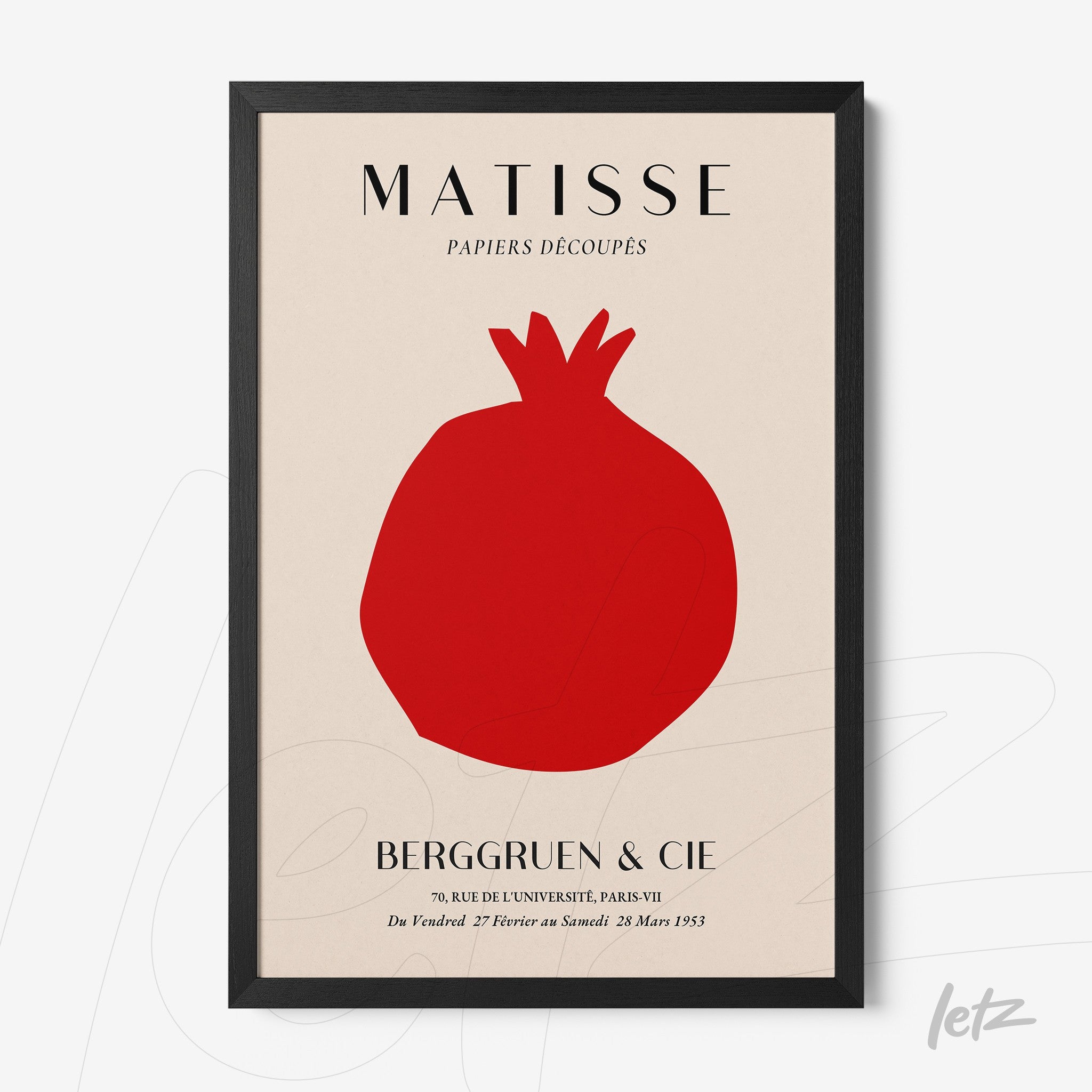 framed modern art print of a pomegranate on cream background with black frame