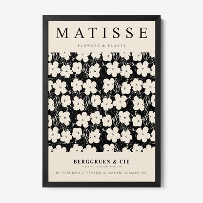 framed vintage style artwork featuring white flowers on a black background with a simple black frame