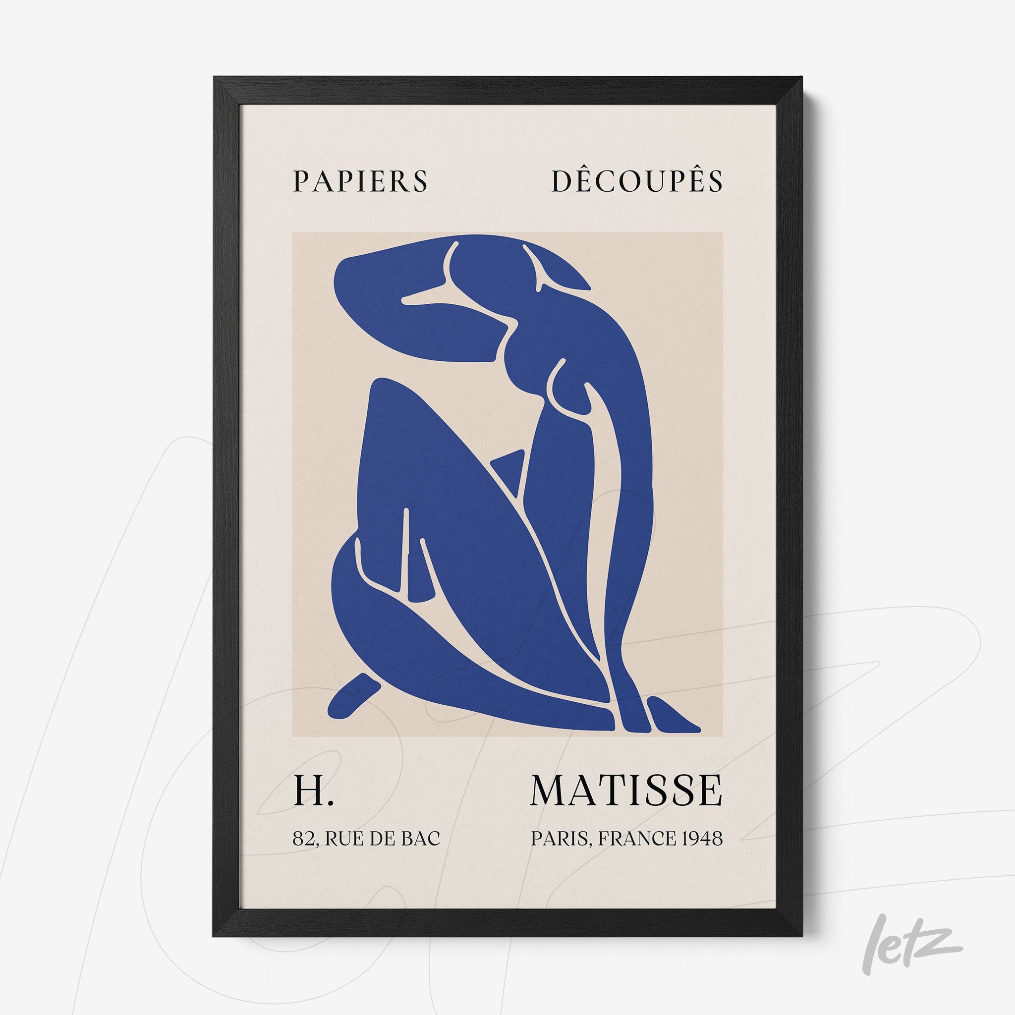 framed wall art featuring henri matisse's minimalist style in blue shapes on cream background with black frame