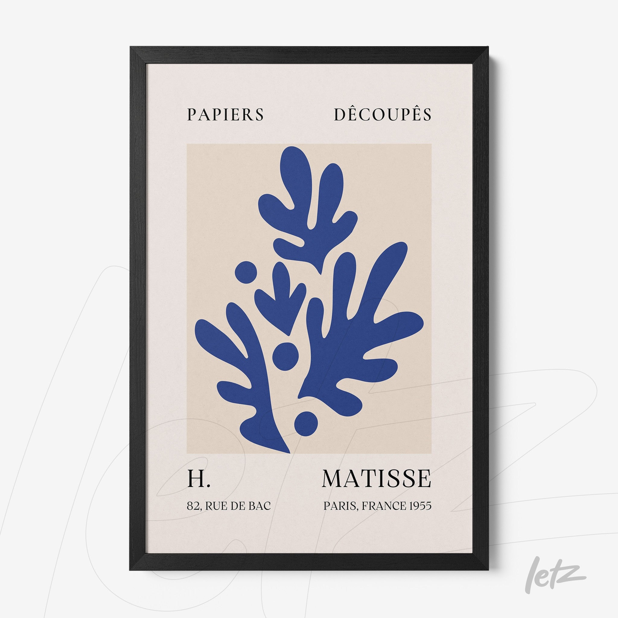 framed modern art print featuring abstract blue shapes on cream background with thin black frame