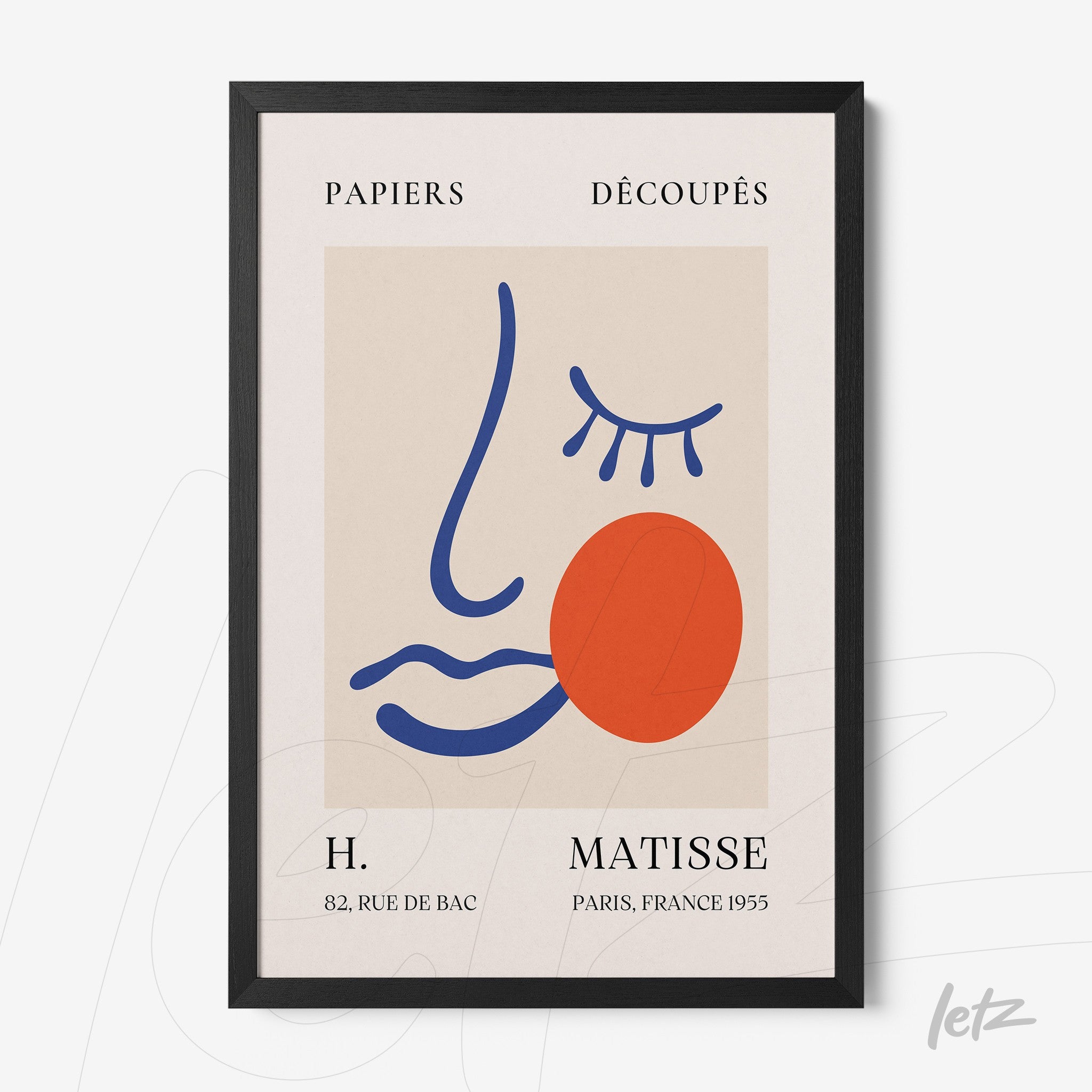 framed modern art print of a stylized face in black frame, neutral background with blue and red accents