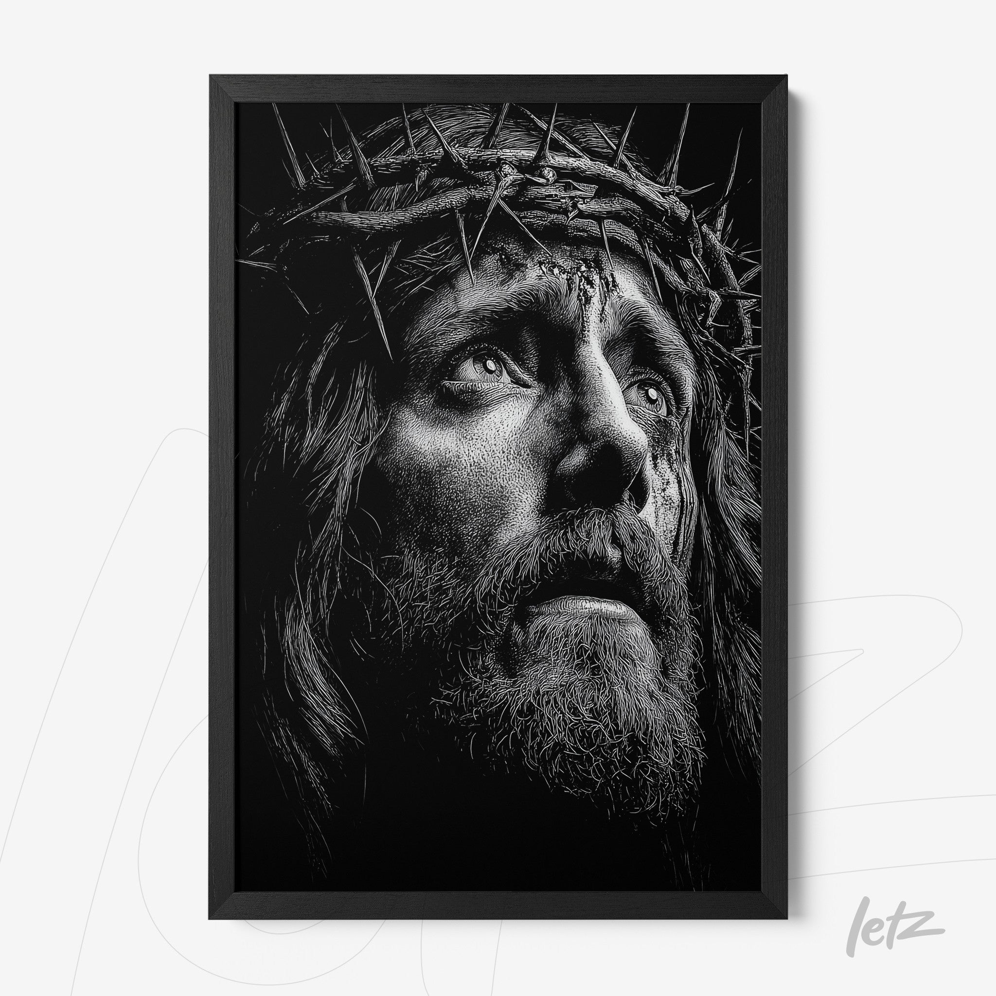 framed black and white artwork depicting a contemplative face of Jesus wearing a crown of thorns