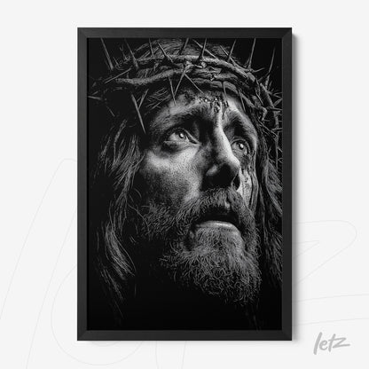 framed black and white artwork depicting a contemplative face of Jesus wearing a crown of thorns