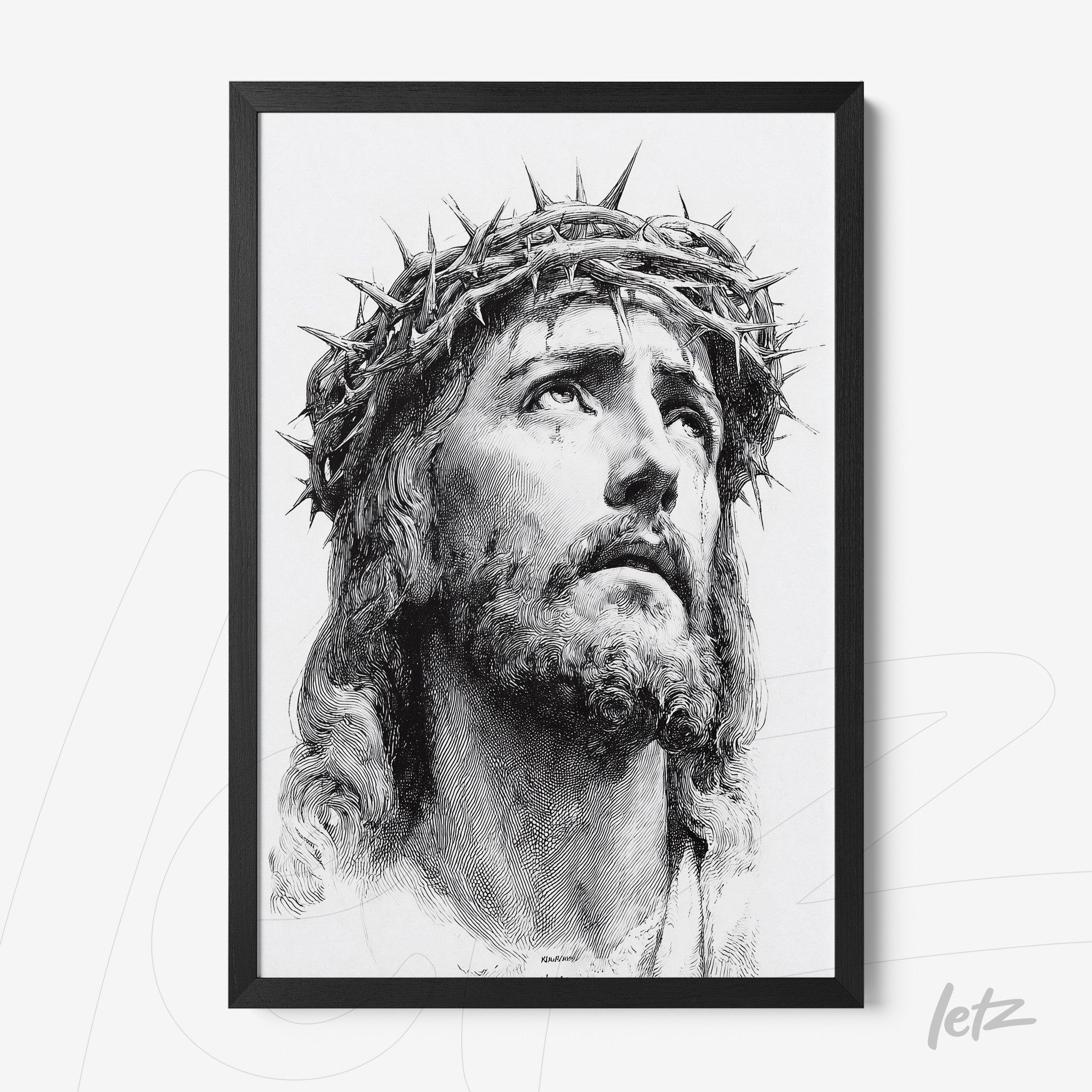 framed portrait of Jesus Christ wearing a crown of thorns in black frame