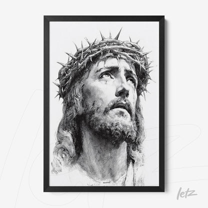 framed portrait of Jesus Christ wearing a crown of thorns in black frame