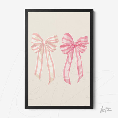 framed artwork featuring pink bows with ribbons on a light background