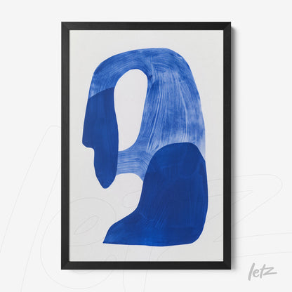 framed wall art featuring abstract blue shapes on a white background with a black frame