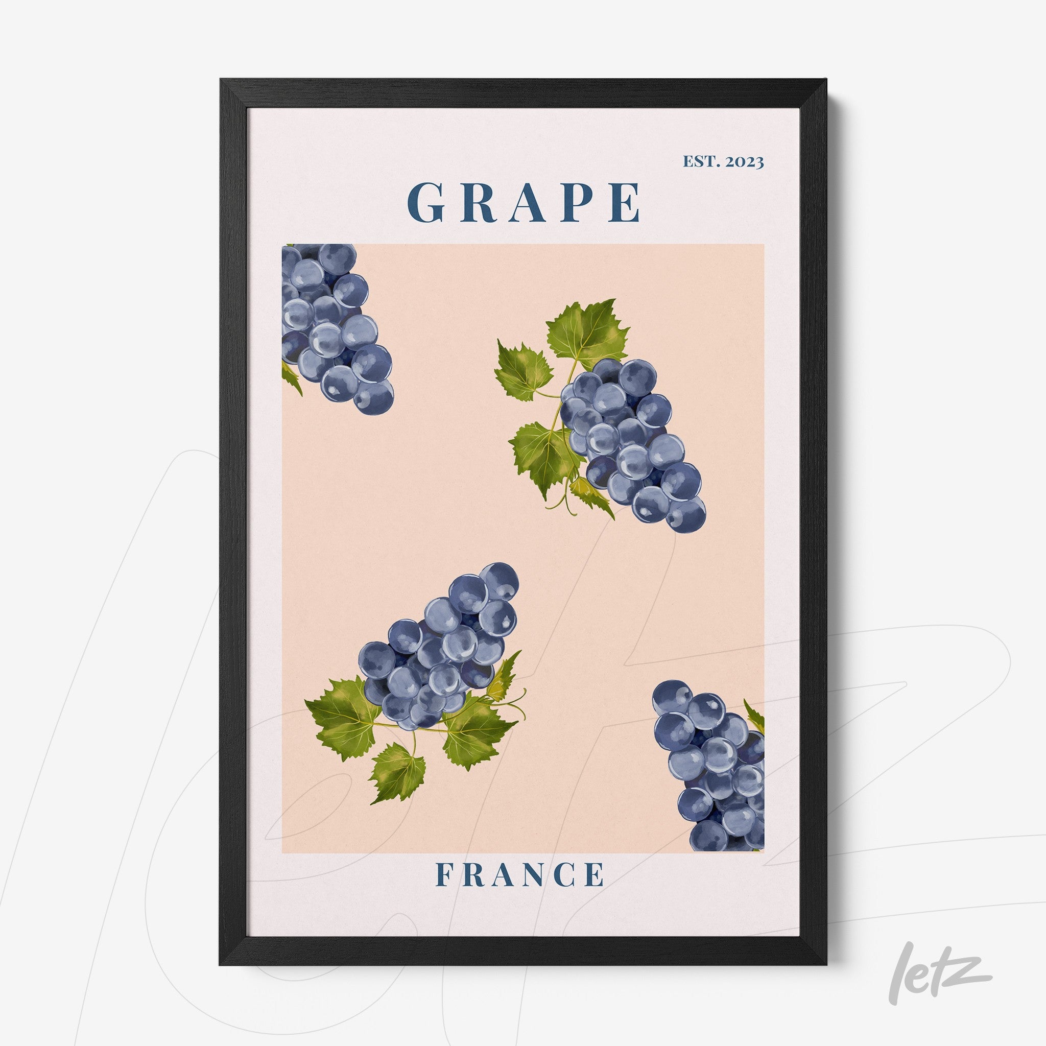 framed wall art featuring grapes on a pink background with black frame