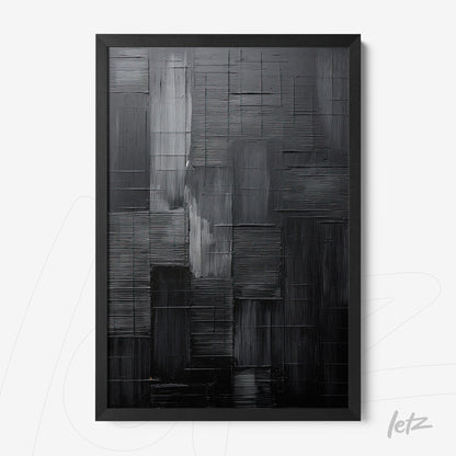 abstract wall art in shades of black and gray with a black frame