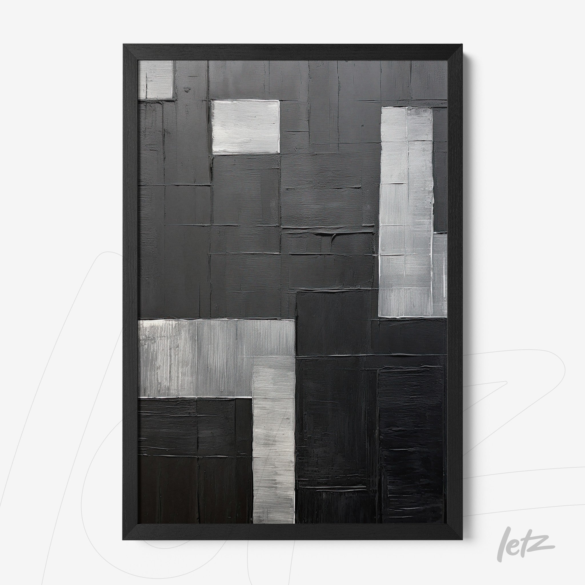 framed abstract artwork in shades of gray and black featuring distinct geometric shapes with varying textures