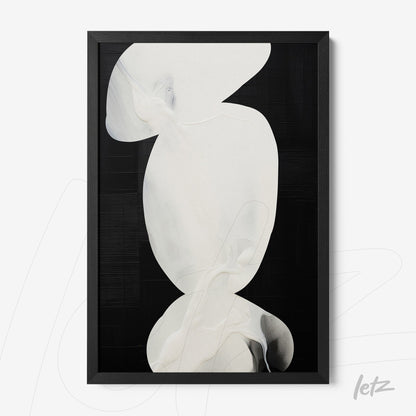 abstract wall art in black frame featuring white shapes on black background