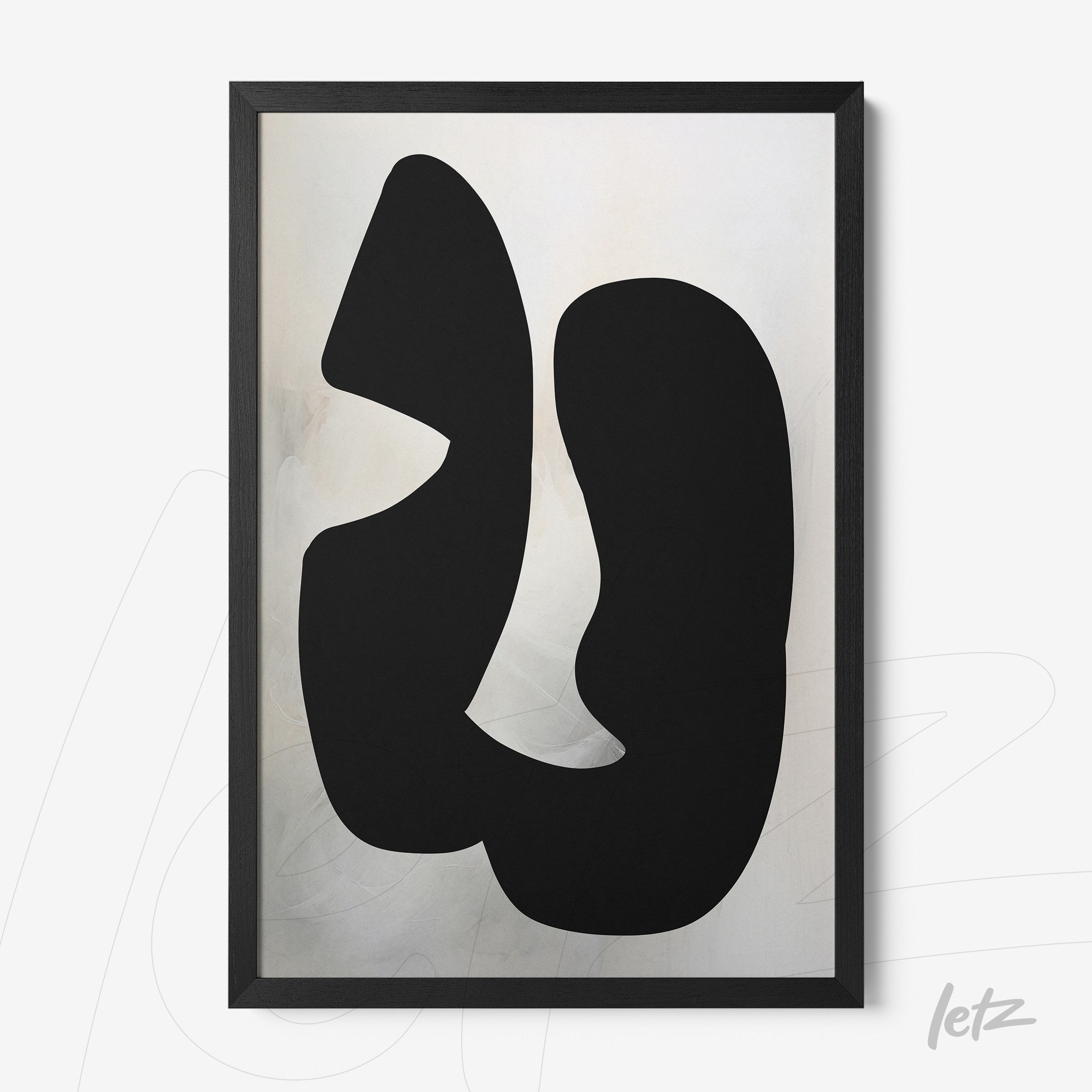 framed abstract art in black on light background with black wooden frame