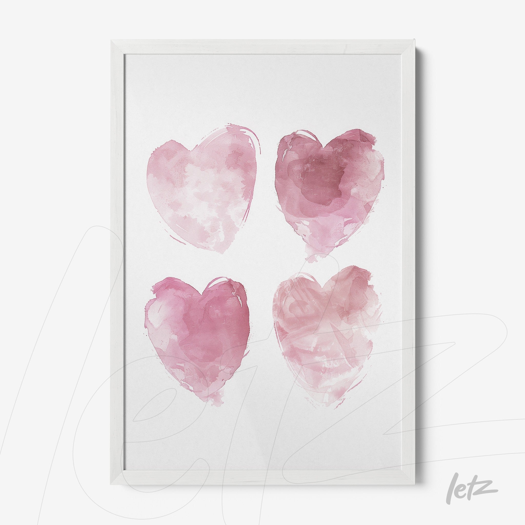 framed artwork featuring four pink watercolor hearts in white frame