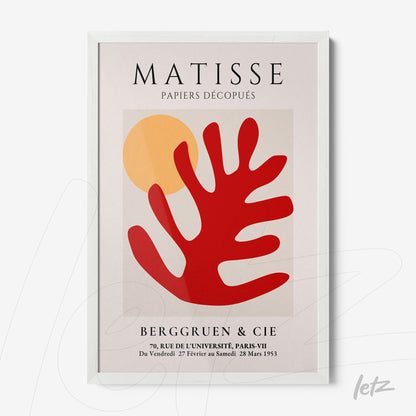 framed wall art featuring cut-out design in red and yellow with organic shapes