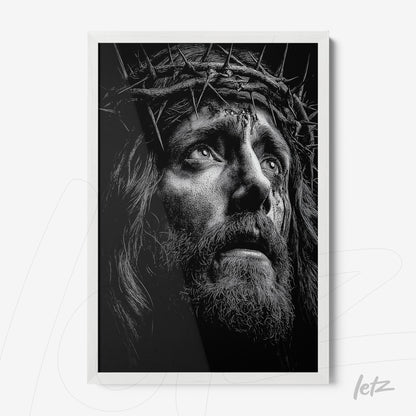 framed black and white artwork of Christ's face with a crown of thorns in white frame