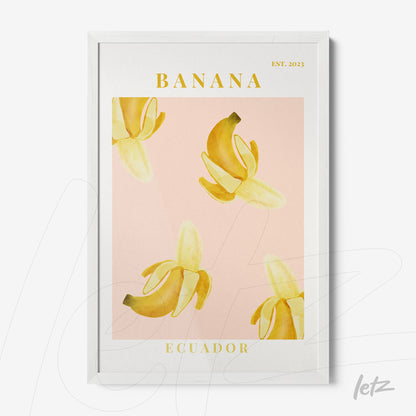 framed artwork featuring yellow bananas on a pink background with white frame