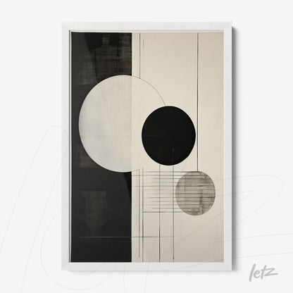 framed abstract artwork in white frame featuring black and gray circles on a light background