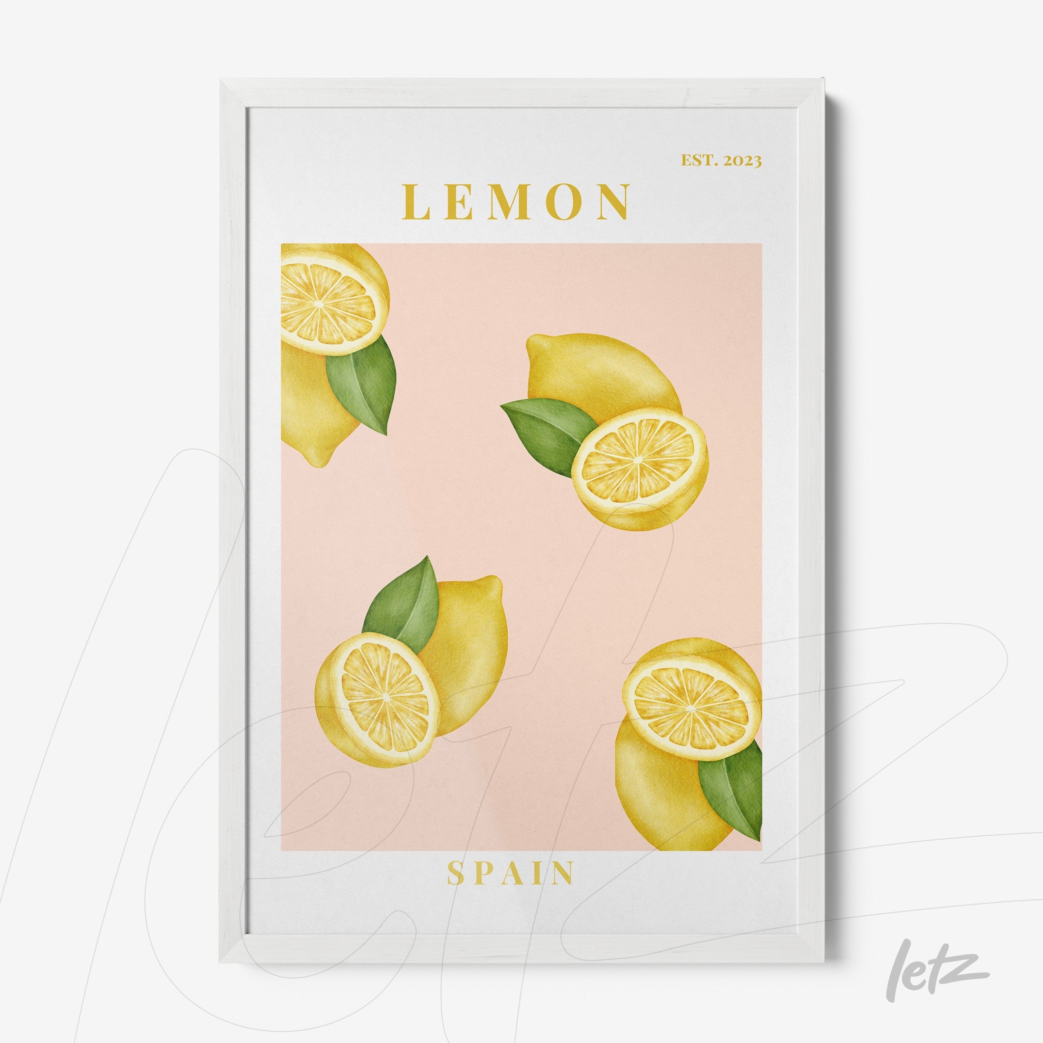 framed wall art featuring lemons on a light pink background with white frame and green leaf elements