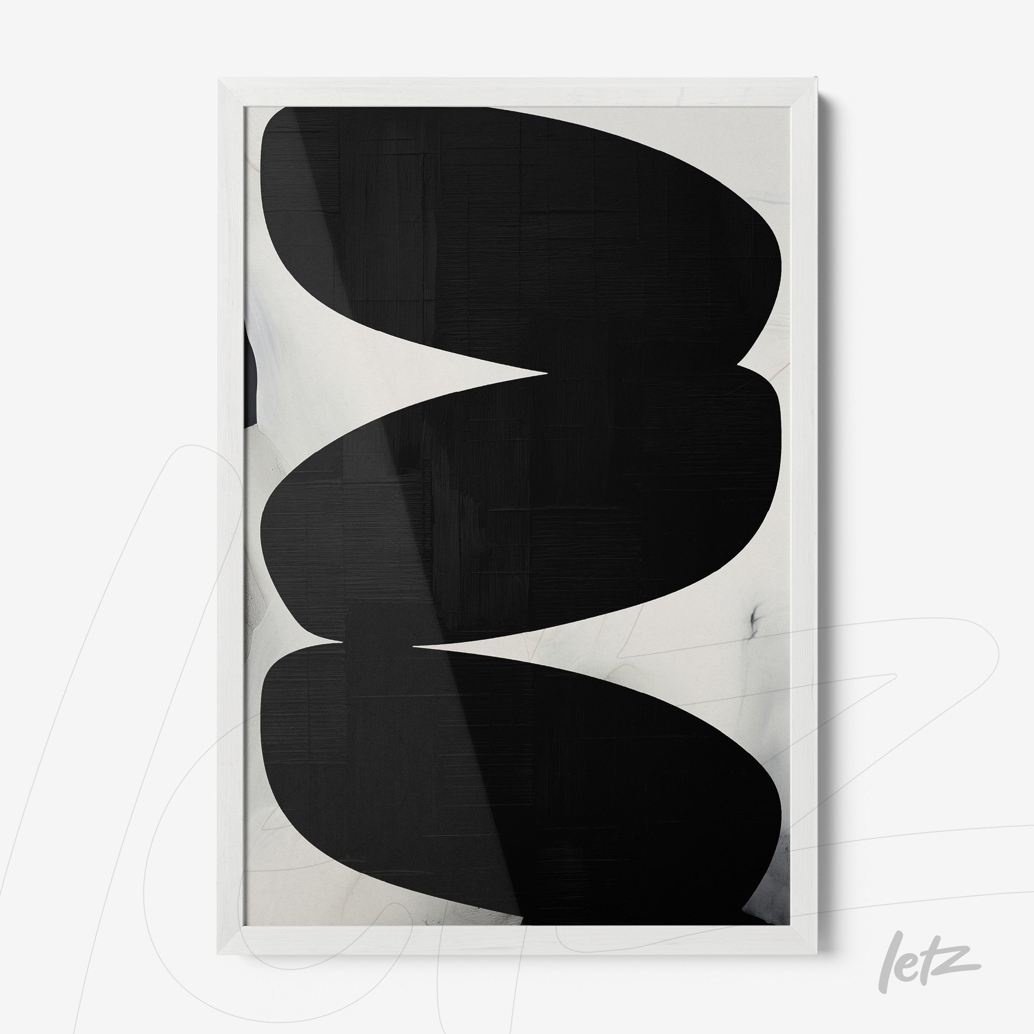 abstract wall art in black and white featuring organic shapes in white frame