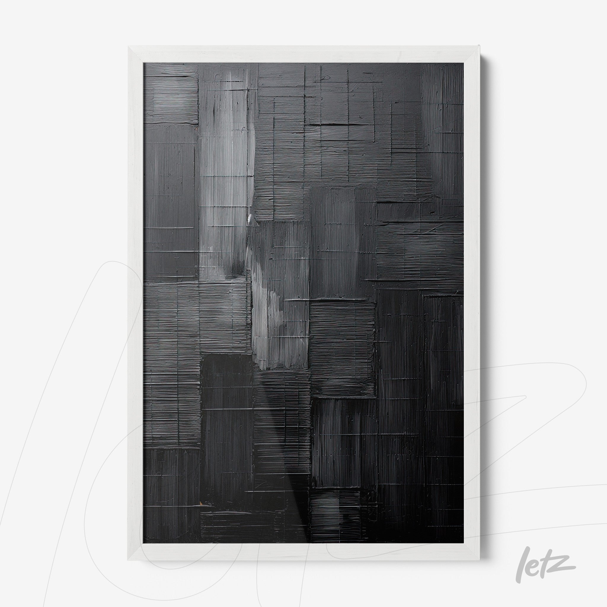 framed abstract wall art with striking black texture in white frame