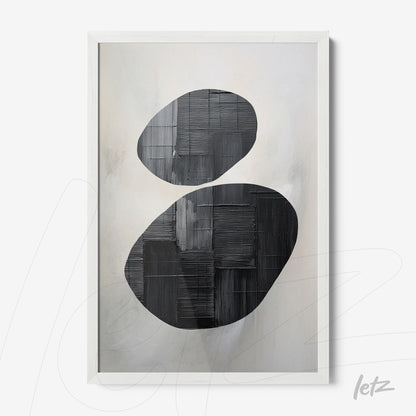 framed abstract art featuring black and white color tones, with oval shapes and textured brush strokes