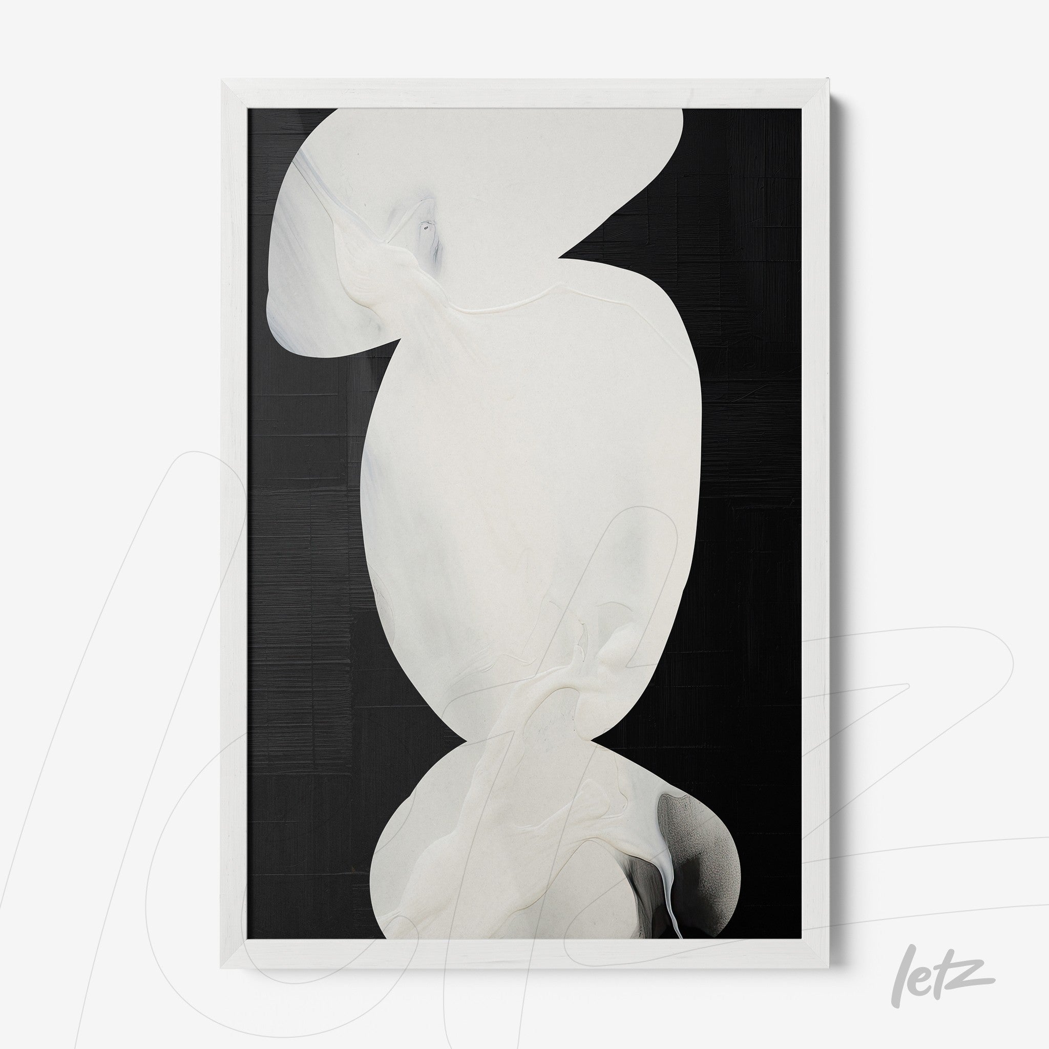 framed abstract art in light tones set against a black background