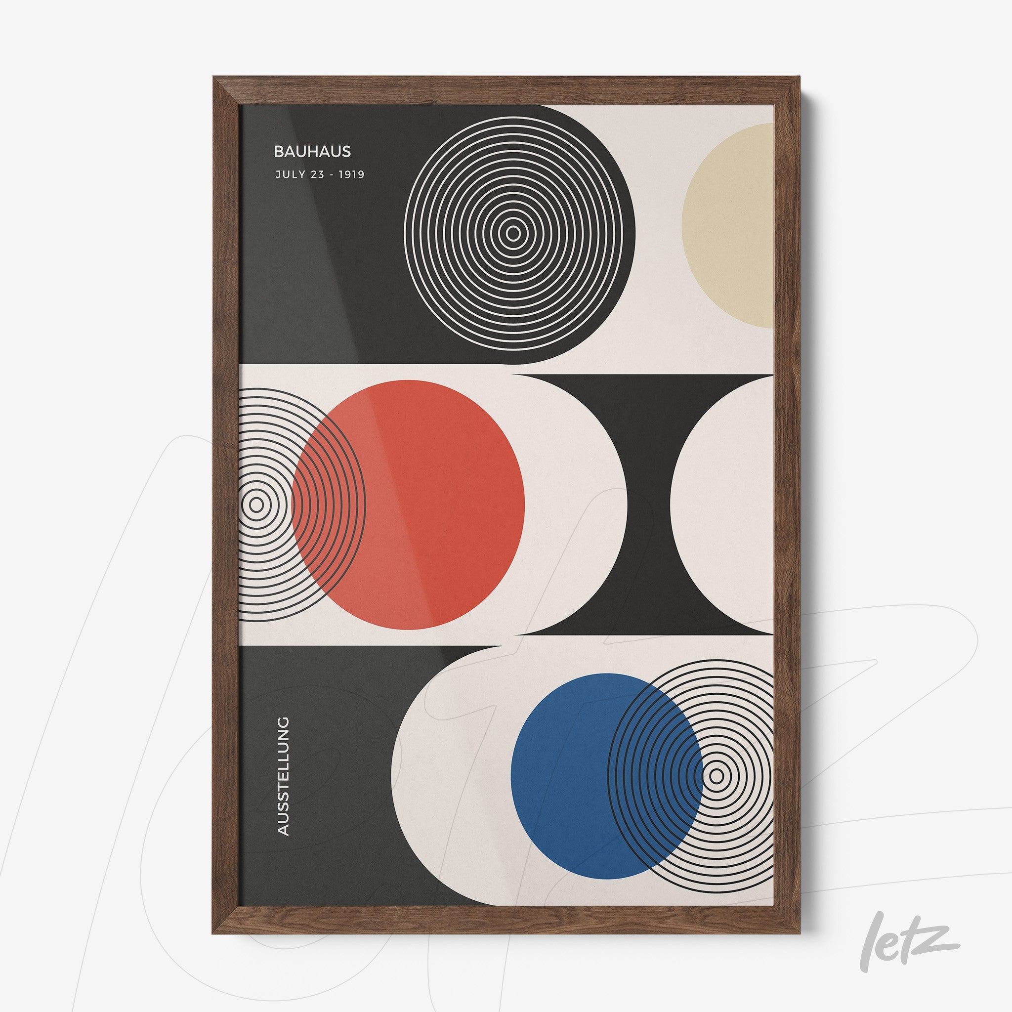 canvas with geometric abstract art in a wooden frame, featuring concentric circles and colorful shapes in black, red, and blue