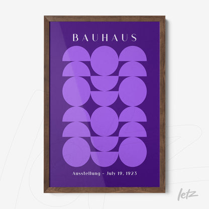 poster featuring purple geometric art and bauhaus text in wooden frame