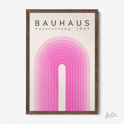 wood framed poster featuring geometric design in shades of pink portraying a stylized rainbow, top text reads 'bauhaus ausstellung 1923'