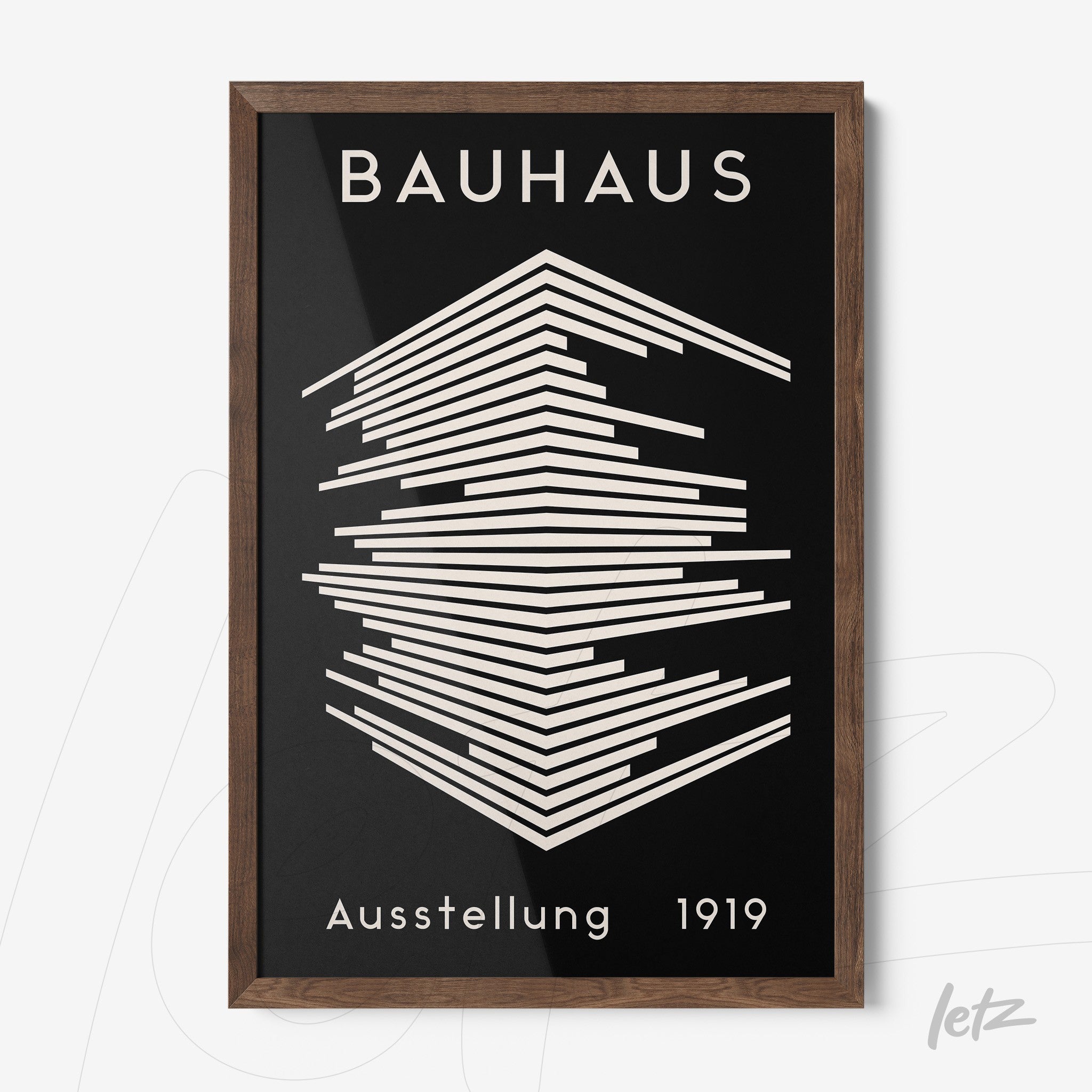 poster featuring graphic art of the Bauhaus movement within a dark wood frame
