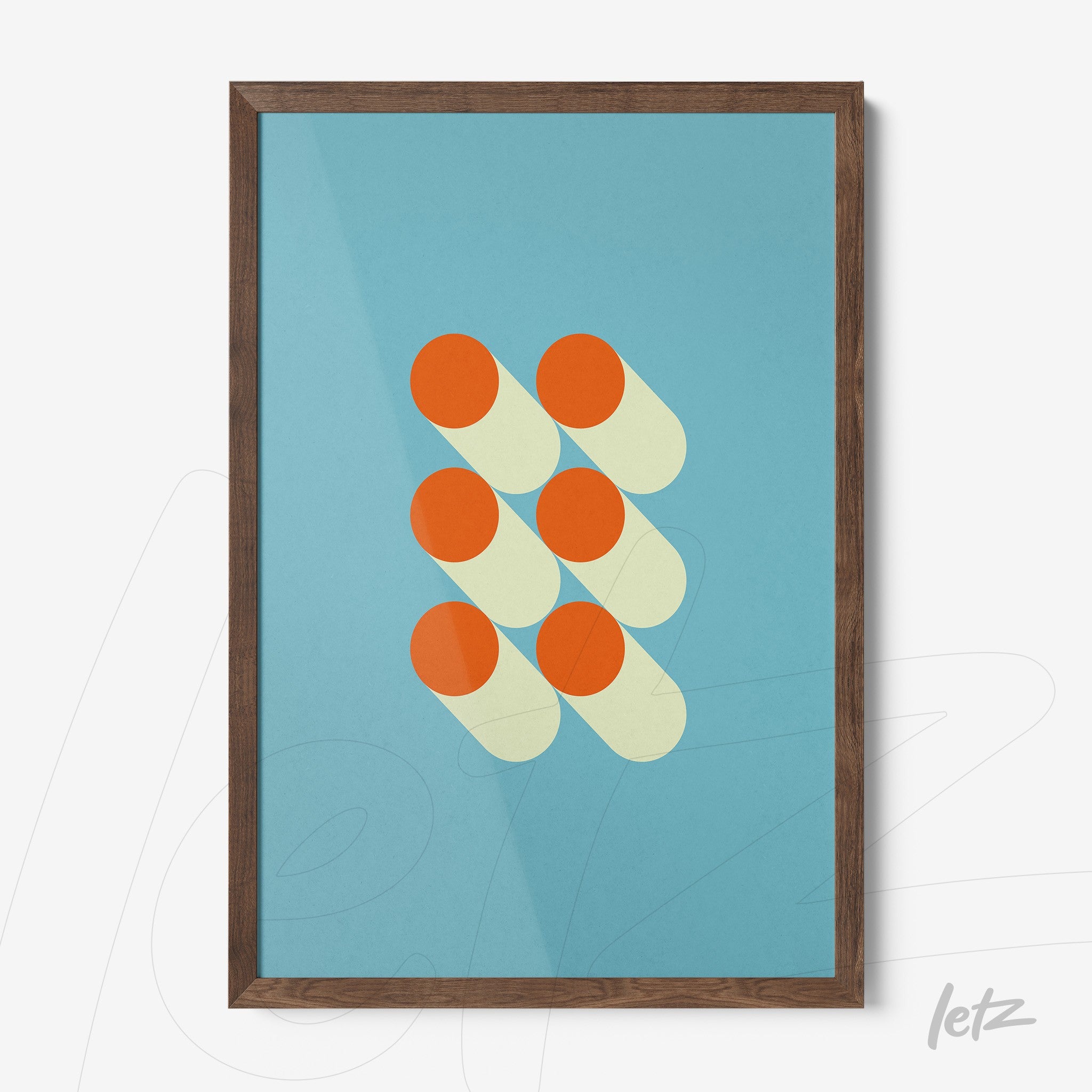 framed geometric wall art featuring orange and beige circles with shadows on a blue background, set in a dark wood frame