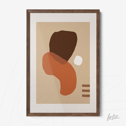 framed wall art of geometric shapes in earthy tones with dark wood frame