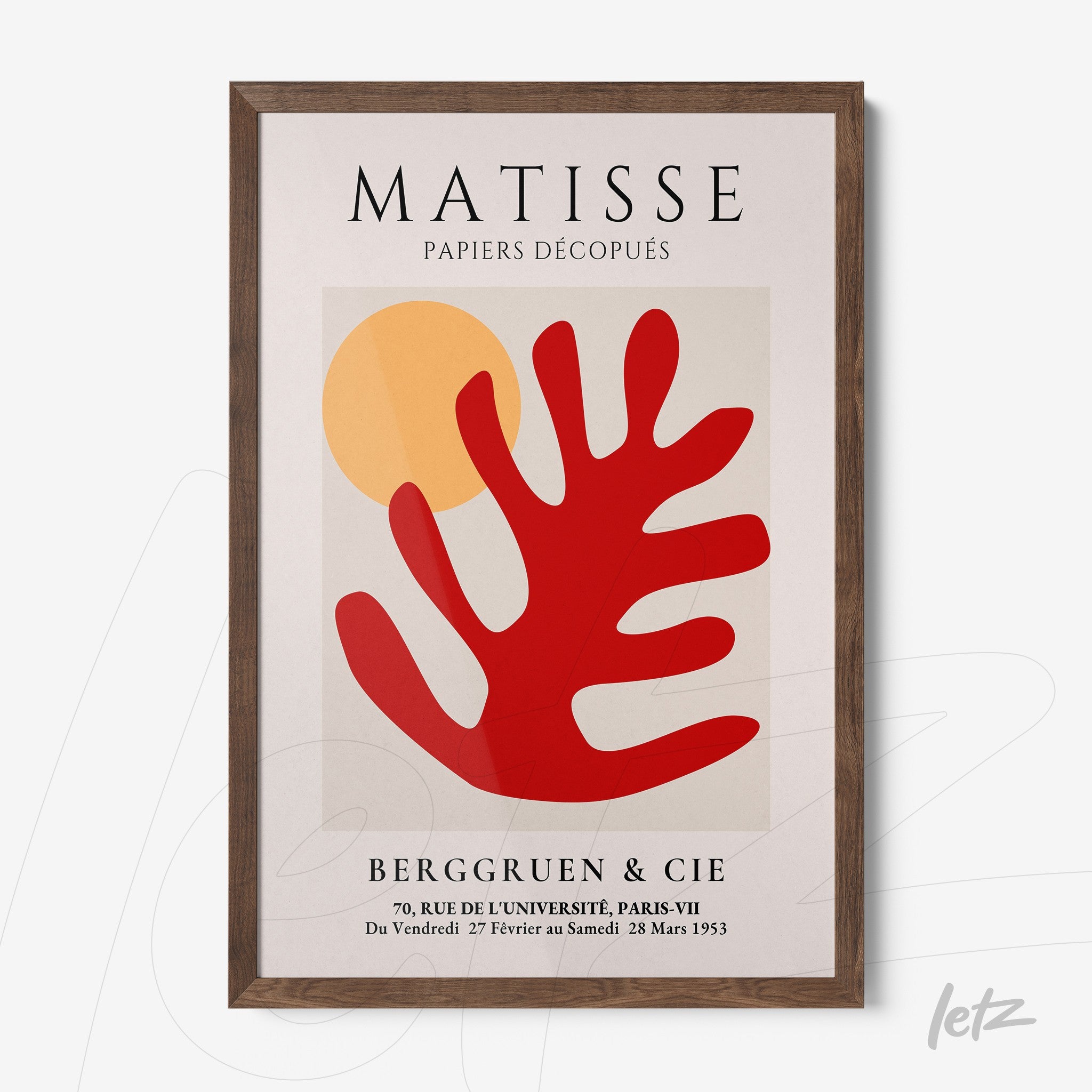 modern wall art featuring a vibrant red stylized leaf and a yellow background, framed in dark wood