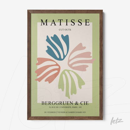 framed modern art print of cutouts in the style of Matisse with dark wood frame