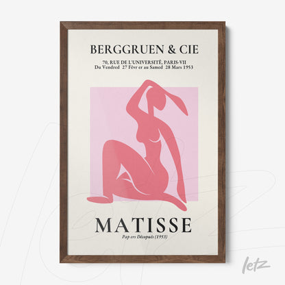 framed artwork featuring an abstract pink figure with a dark wood frame