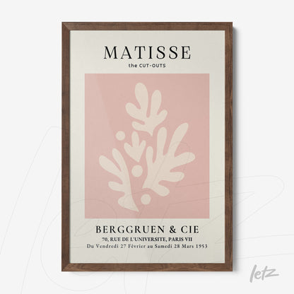 decorative framed art featuring matisse style cut-outs with abstract shapes on soft pink background in dark wood frame
