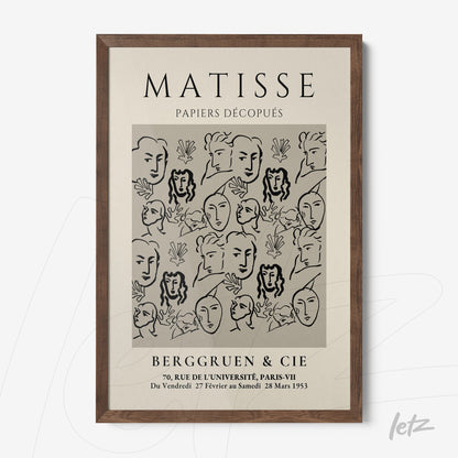 framed wall art featuring modern illustration of faces on light background with dark wood frame