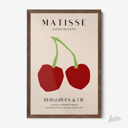 abstract wall art featuring red cherries in green with dark wooden frame